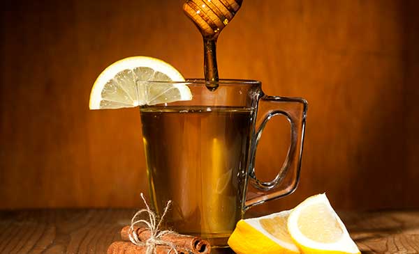glass mug of starbuck's medicine ball tea