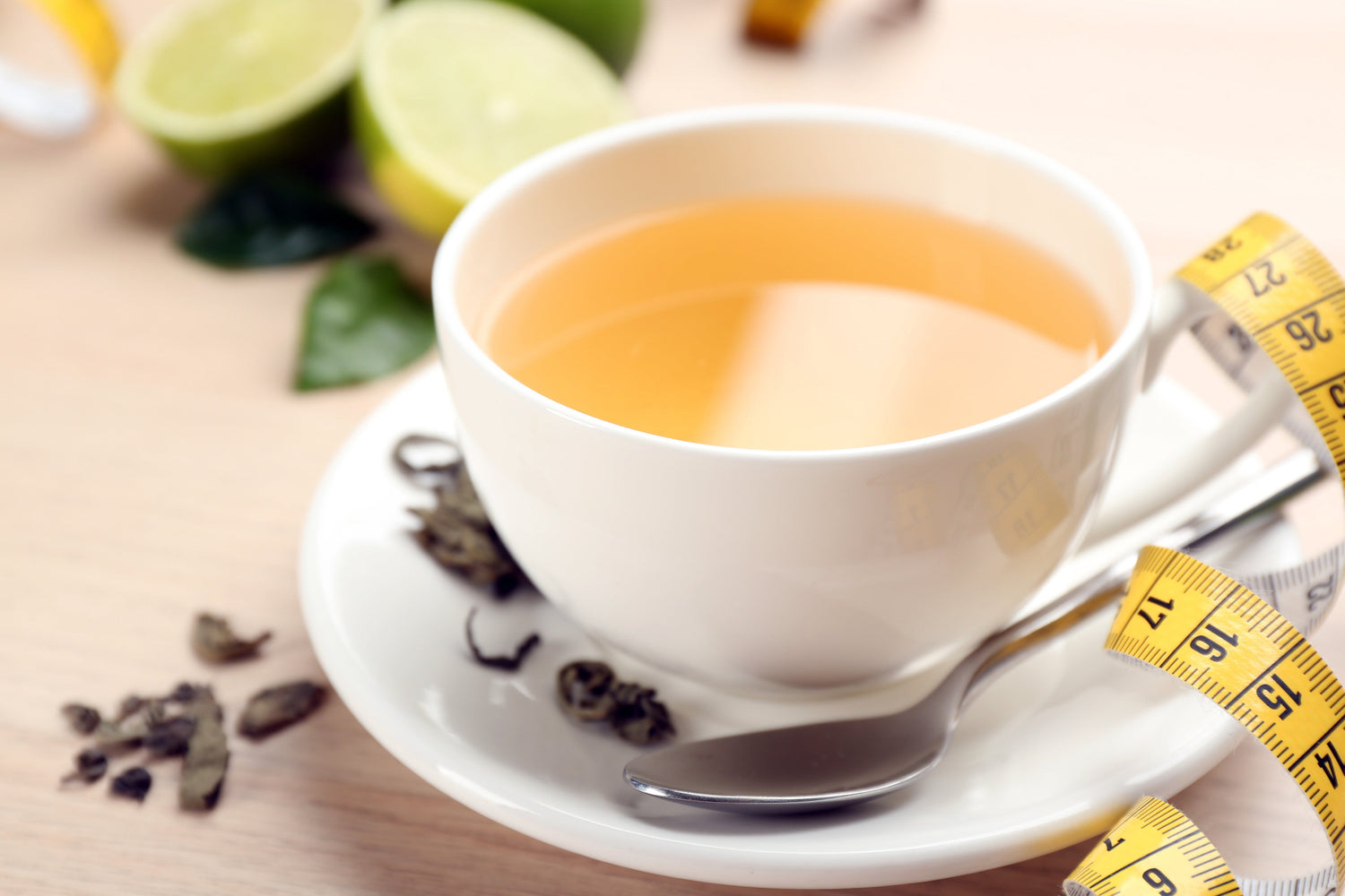 cup of green tea with tape measure for weightloss
