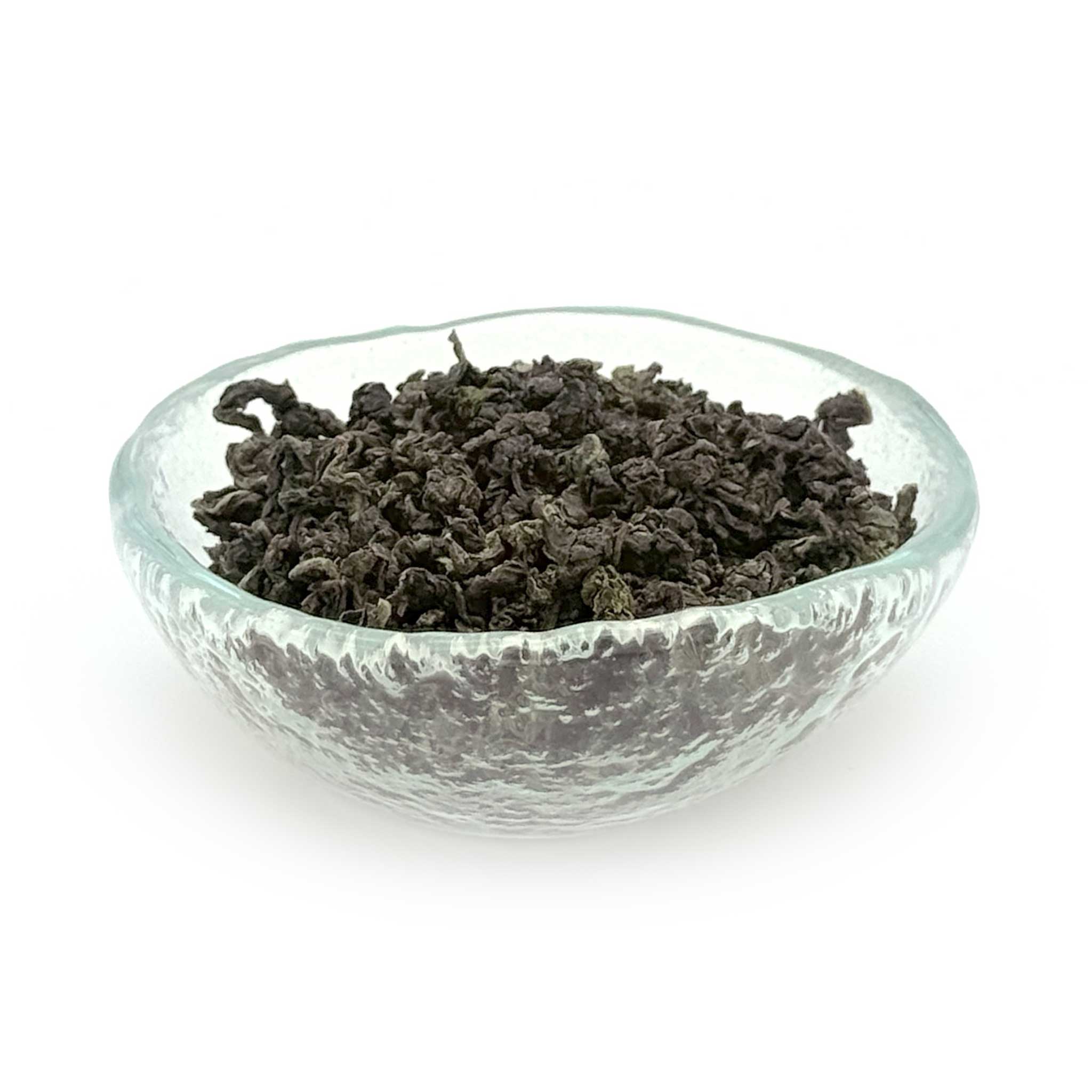 glass dish of ti kuan yin (or iron buddha tea)
