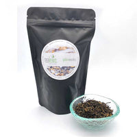 golden monkey tea in a glass dish and pouch by Tealeavz 