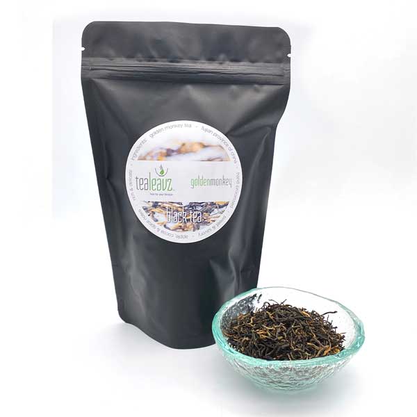 golden monkey tea in a glass dish and pouch by Tealeavz 