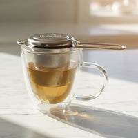 stainless steel tea strainer steeping tea in mug